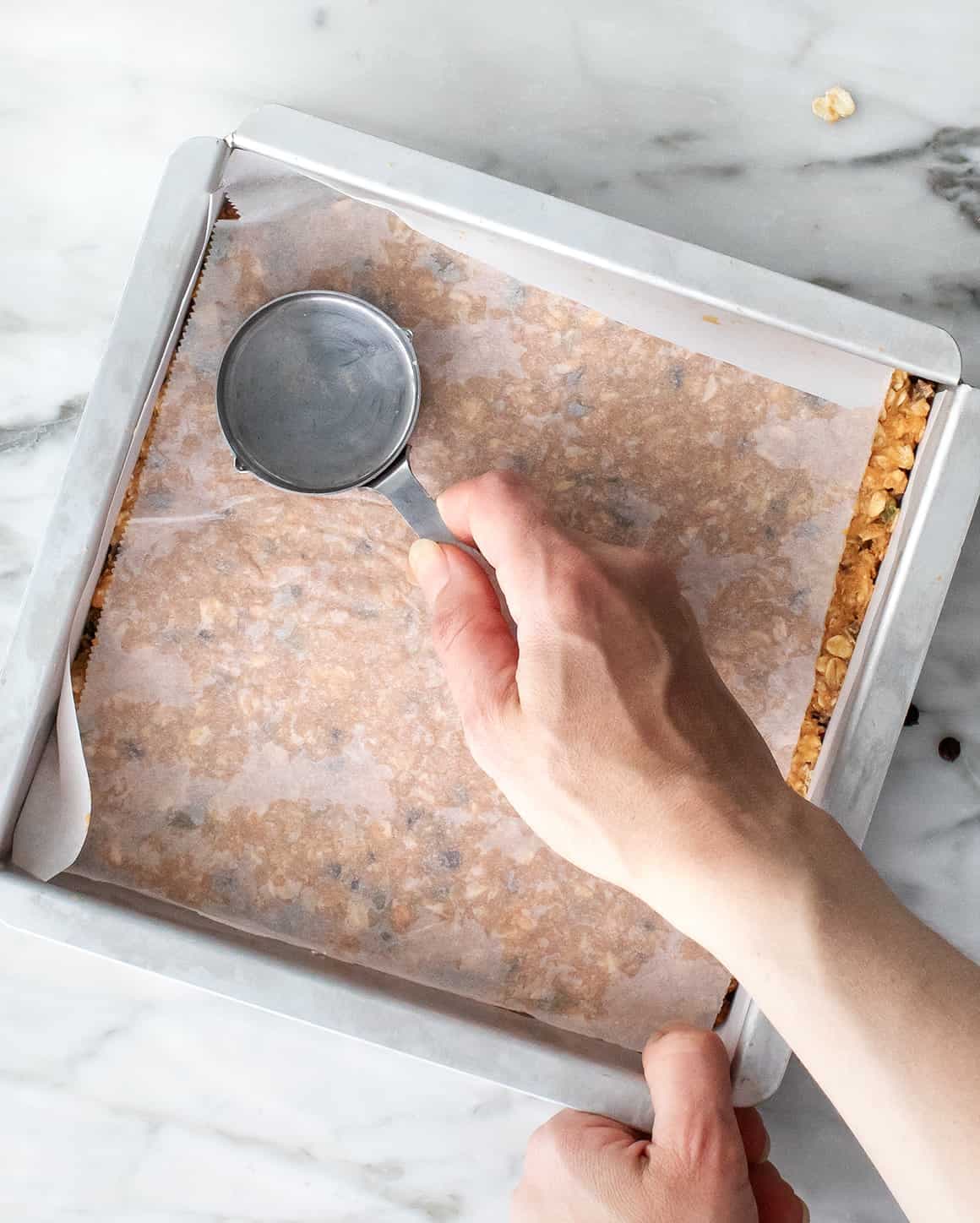 Homemade granola bars in a baking pan