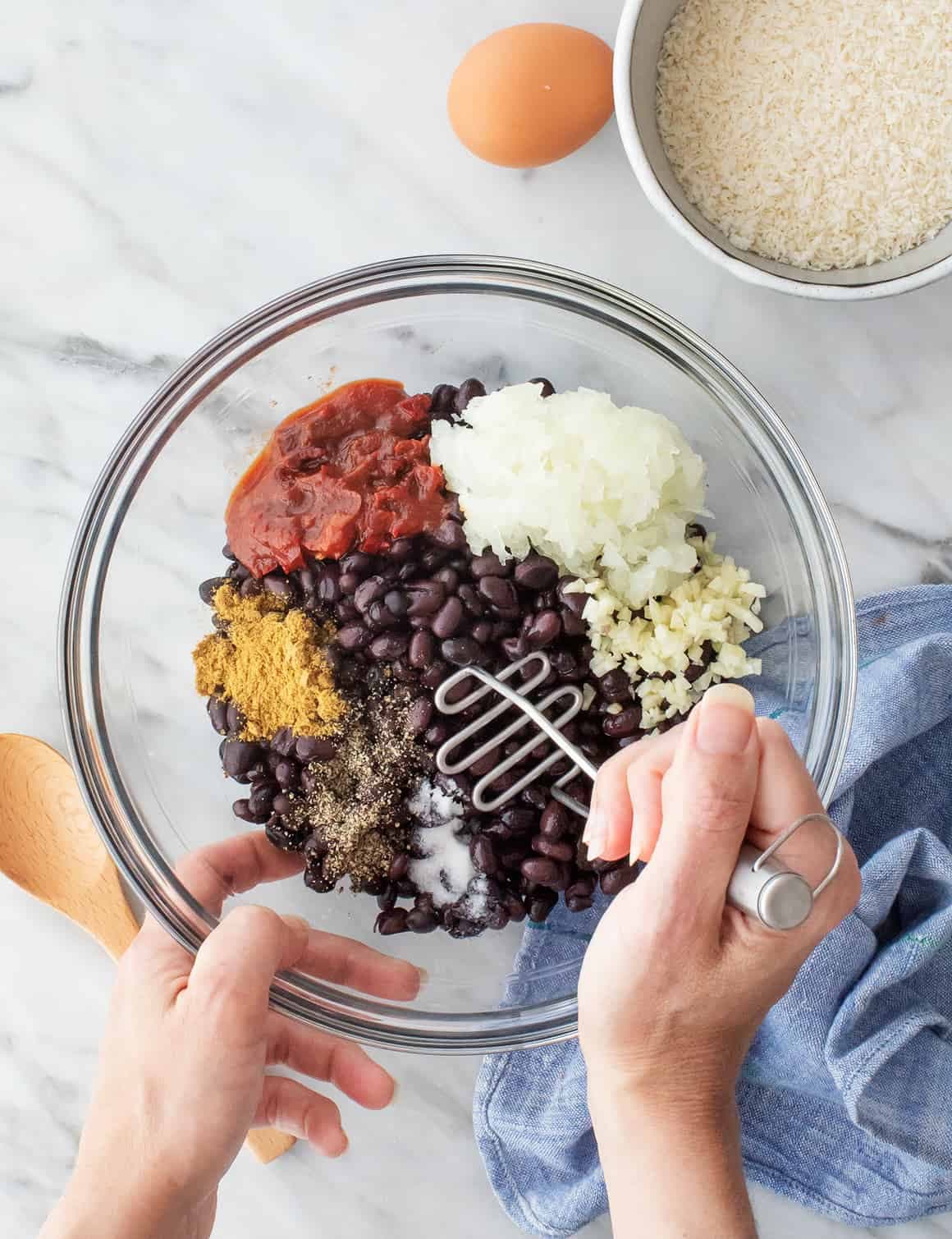 Black beans, onion, and spices in a bowl
