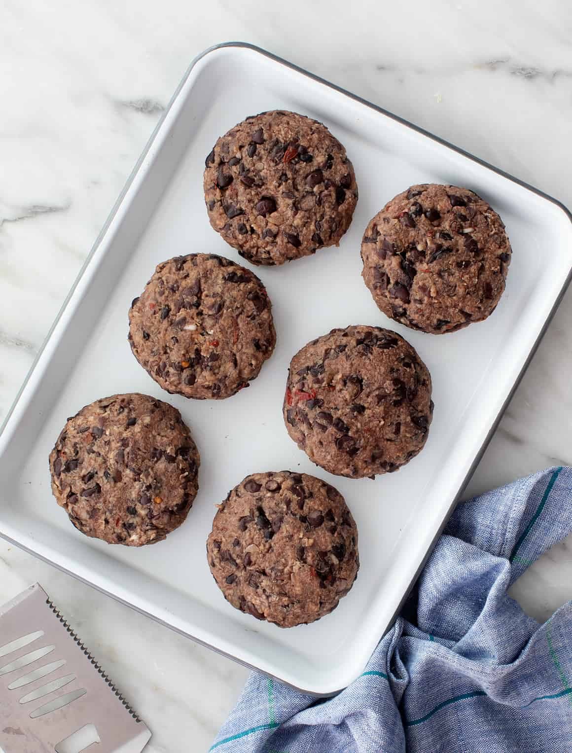 Black bean burgers on a baking sheet