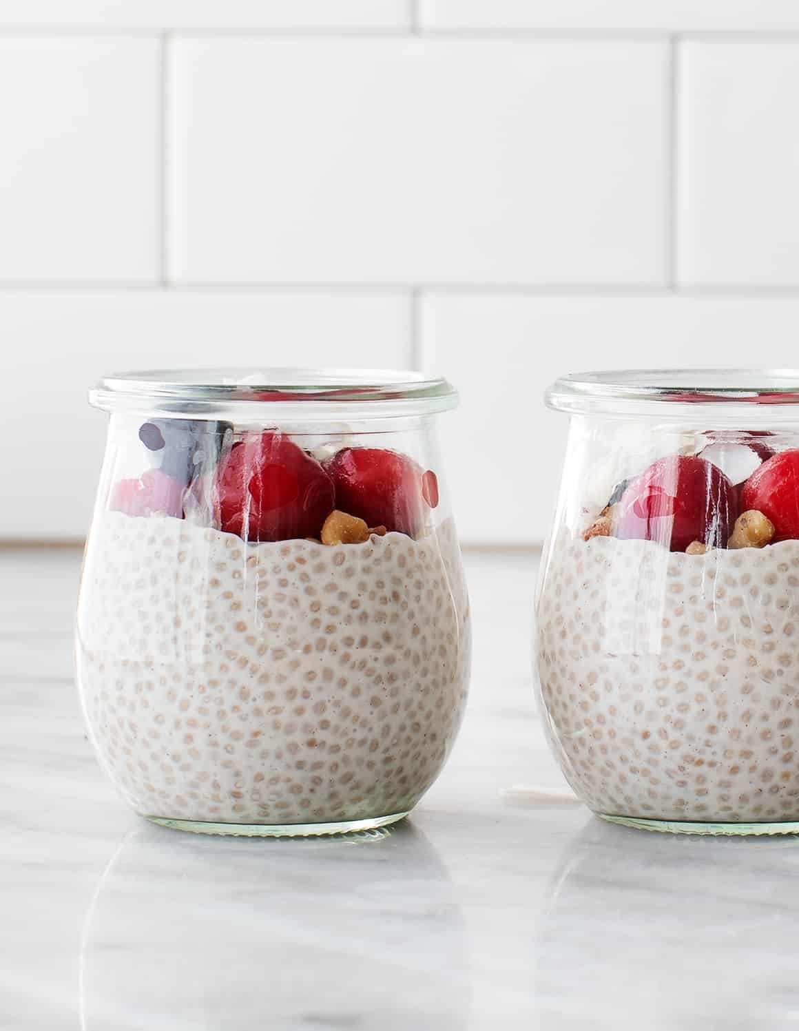 Chia pudding topped with berries and cherries