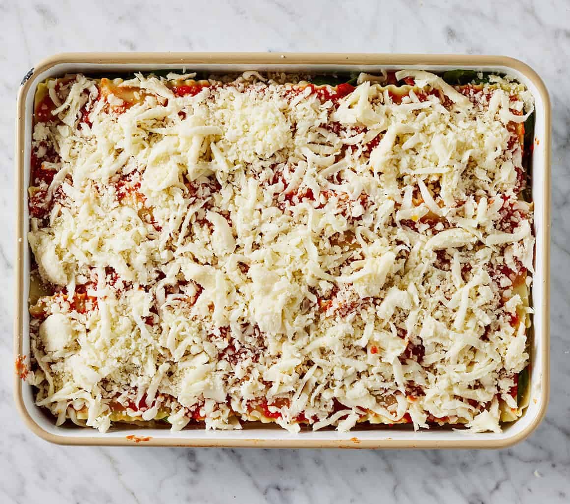 Vegetarian lasagna assembled in baking dish