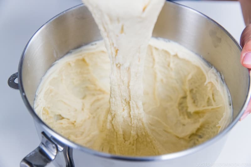 Stop the mixer after 3–4 minutes or when the dough is smooth. It should be sticky and stretchy when you remove the flat beater from the mixer.