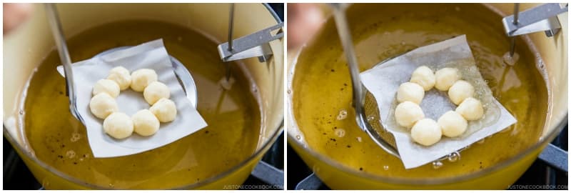 Pick up one parchment square with a donut ring on top. Using your hand or fine-mesh skimmer (the kind that has a flat mesh), carefully place the donut with the parchment paper into the hot oil.